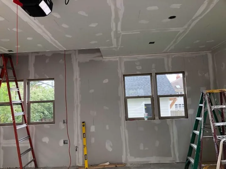 Primed room with finished drywall surfaces